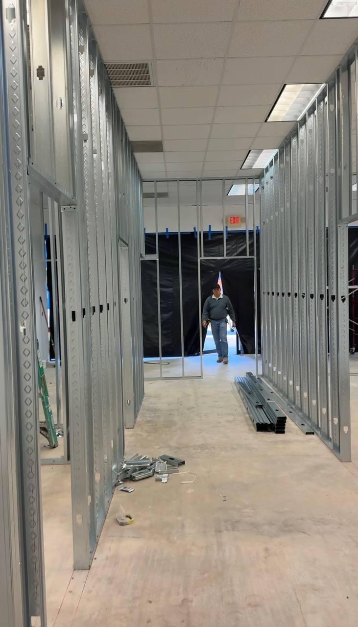 Commercial build-out — steel stud framing corridor in progress